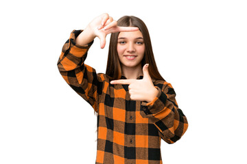 Teenager girl over isolated chroma key background focusing face. Framing symbol