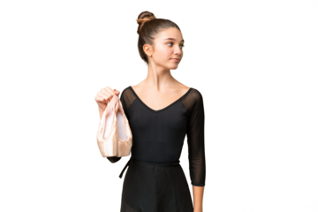 Teenager girl practicing ballet over isolated chroma key background looking to the side
