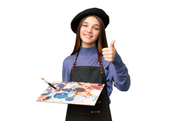 Young artist man holding a palette over isolated chroma key background with thumbs up because something good has happened