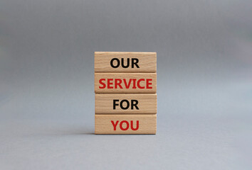 Our service for you symbol. Wooden blocks with words Our service for you. Beautiful grey background. Business and Our service for you concept. Copy space.