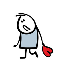 Very sad peron walking and holding big heart toy.