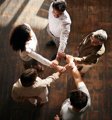 Teamwork, strong and people with linked hands in support, collaboration or team building power in...