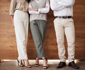 Standing, office and legs of business people with arms crossed for an interview, meeting or...