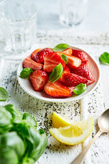Fresh strawberries and basil leaves for strawberry salad