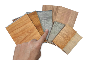 male's hand picking wooden vinyl flooring tiles, engineering flooring tiles, laminated veneers samples isolated on background with clipping path. multi texture and color of interior material samples.