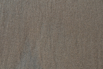 Fototapeta na wymiar Photo background texture of wet sand on the beach.
