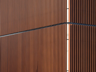 architecture of brown aluminum line wall