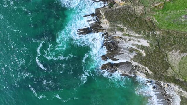 Coastal landscape of cliffs, meadows and sea in the area of Punta Ballota between Tagle and Ubiarco. Aerial view from a drone. Cantabrian Sea. Cantabria, Spain, Europe