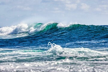 White foamy splashing waves on the beach