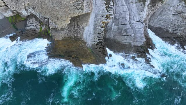 Coastal landscape of cliffs, meadows and sea in the area of Punta Ballota between Tagle and Ubiarco. Aerial view from a drone. Cantabrian Sea. Cantabria, Spain, Europe