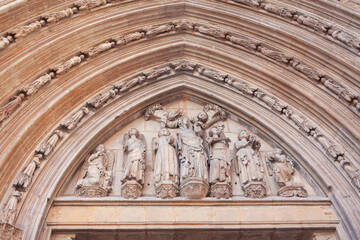 Cathedral portal with sculptures . Entrance ornamental of Valencia Cathedral