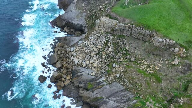 Coastal landscape of cliffs, meadows and sea in the area of Punta Ballota between Tagle and Ubiarco. Aerial view from a drone. Cantabrian Sea. Cantabria, Spain, Europe