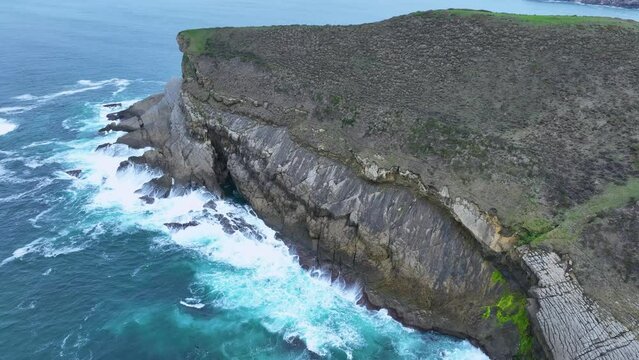Coastal landscape of cliffs, meadows and sea in the area of Punta Ballota between Tagle and Ubiarco. Aerial view from a drone. Cantabrian Sea. Cantabria, Spain, Europe