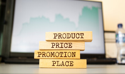 Fototapeta premium Wooden blocks with words 'product price promotion place'. Business concept