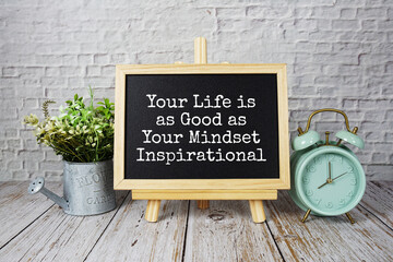 Inspirational quotes of "Your Life is as Good as Your Mindset Inspirational" text message on wooden board