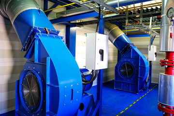 Large fans in an industrial boiler room