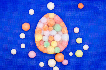 Unusual fragrant handmade soap with colored soap balls a blue background.