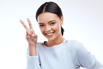 Peace sign, woman portrait and hand with emoji gesture in a studio with happiness on backdrop. V hands, isolated and white background of a gen z and young model with a happy smile and cool hands