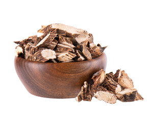 Calamus root in wooden bowl, isolated on white background. Sweet flag, sway or muskrat root. Dry root of Acorus calamus.