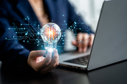 Businesswoman holding Light bulbs with Brain inside and circuit board line background, creative and innovative inspiration, artificial intelligence digital. Business idea strategy concept.