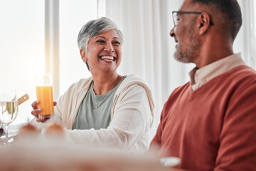 Happy, elderly and a couple talking at breakfast, laughing at a joke and enjoying juice together....