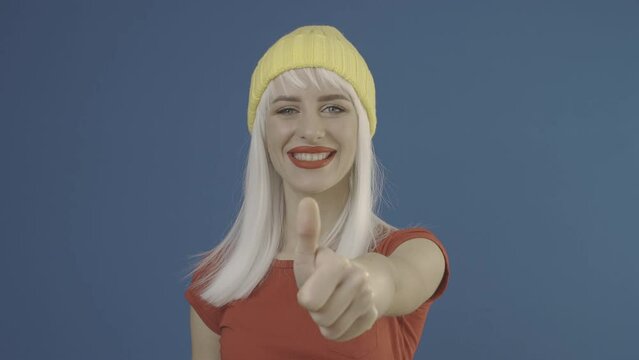 Happy lady is showing thumbs up gesture and smiling. Slog2 ungraded LOG 10bit 422 ProRes raw chroma key footage