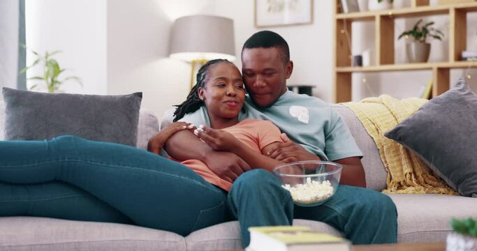 Laughing couple relax to watch movies on tv, comedy and cable show of funny broadcast, sofa and popcorn. Happy man, woman and black people change television remote on streaming, subscription or smile