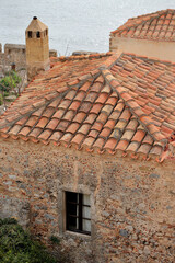 Fototapeta premium Monemvasia - roofs and chimneys of tenement houses from Byzantine times in Monemvasia in Peloponnese (Greece)