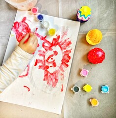 child painting easter eggs