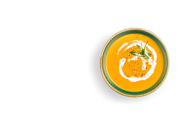 Pumpkin soup isolated on white background. Top view. Copy space.