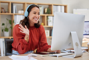 Headphones, computer and woman video call, webinar or virtual meeting, talking and online networking in business office. Happy Asian person wave hello on her desktop pc in client chat at tech company