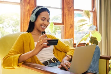 Fototapete Musikladen Woman, laptop and credit card with ecommerce and headphones to listen to music while online shopping. Happy female relax at home, podcast or radio streaming with fintech, internet banking and payment