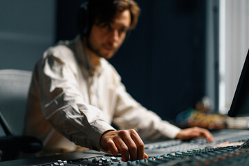 Fototapeta premium Sound engineer used digital audio mixer Sliders Engineer presses keys Control panel Recording studio technician