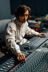 Sound engineer used digital audio mixer Sliders Engineer presses keys Control panel Recording...