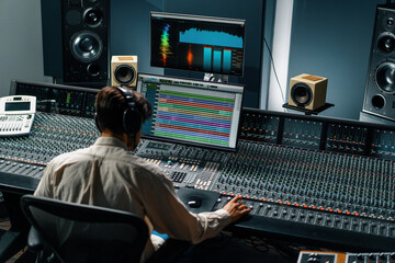 Sound engineer used digital audio mixer Sliders Engineer presses keys Control panel Recording studio technician