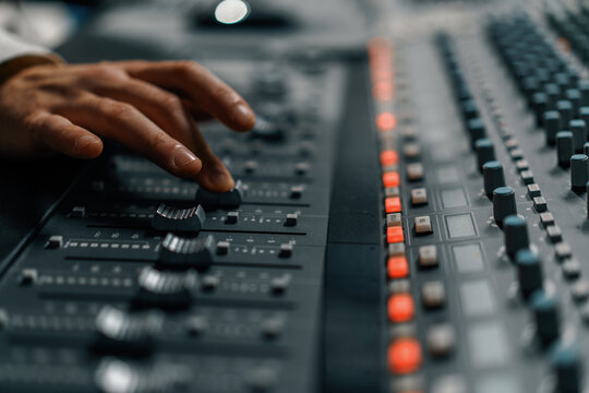Sound engineer used digital audio mixer Sliders Engineer presses keys Control panel Recording studio technician
