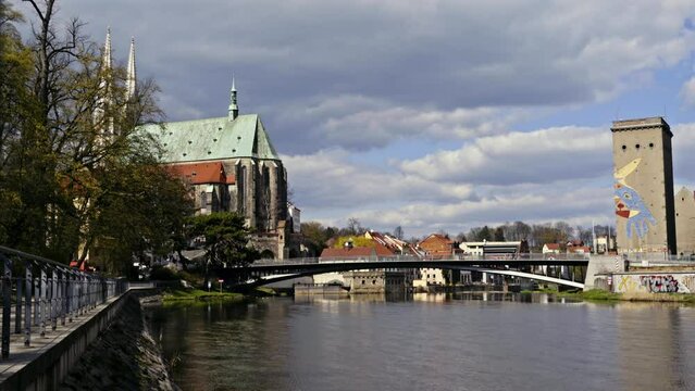 Neisse river in G&ouml;rlitz. Old Town Bridge connects G&ouml;rlitz with Zgorzelec. St. Peter and Paul church in the background. 