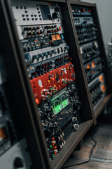 old displays of professional analog vu meters in a recording studio measuring and showing decibels
