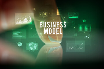 Finger touching tablet with business graphs and icons concept