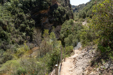 Hanging walkways nailed into the rock that runs inside the Vero river canyon in Alquezar, Aragon, Spain.