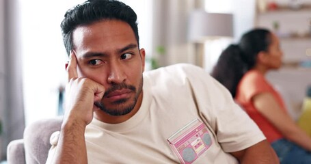 Angry, fight and couple on a sofa arguing about divorce, cheating or breakup in their home together. Marriage, crisis and man with woman on a couch after confrontation, divorce or addiction argument