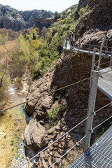 Footbridges of Alquezar on a sunny day on the Vero river, located several meters high, allow you to enjoy this part of the river.