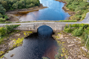 Aerial view of the bridge over Lackagh river close to Doe Castle by Creeslough in County Donegal,...