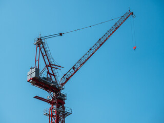 Building under construction, cranes and high-rise building