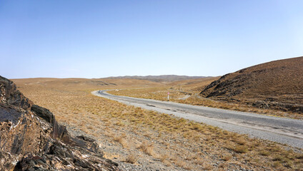 Long road in a desert landscape