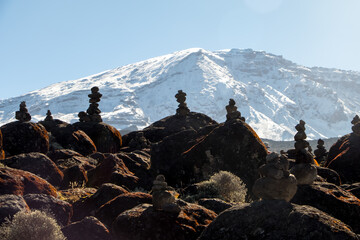 Scenery, rock piles and hiking trail on the slope of Mount Kilimanjaro