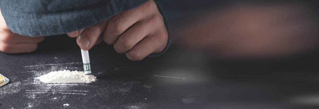 Drug addict taking cocaine. Addiction