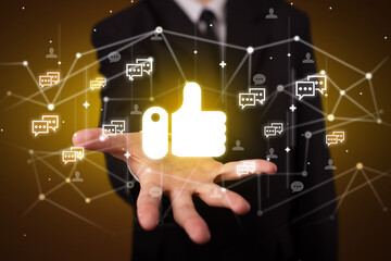 Hand holding social media icons