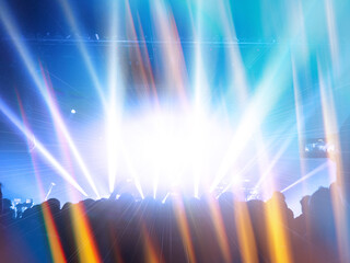 Concert photography during a gig,this is the point of view of the crowd in front of a stage during...