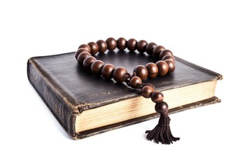 wooden rosary on a white background, old leather bible with a wooden rosary isolated on a white backgroud